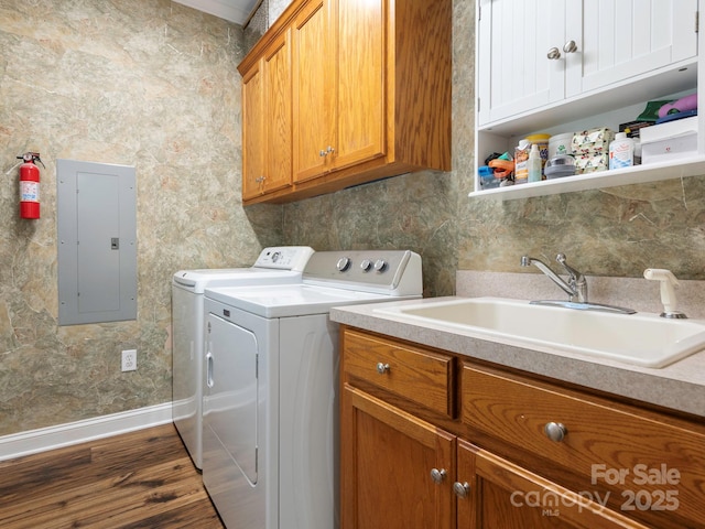 725 Old State St SW, Concord, NC 28027 - laundry room featuring electric panel, washing machine and dryer, cabinet space, baseboards, and dark wood-style flooring