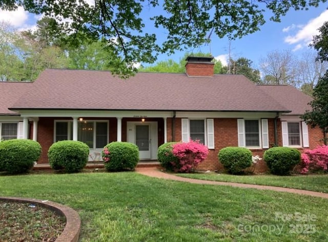 1614 Statesville Blvd, Salisbury, NC 28144 - single story home featuring a chimney, a front yard, brick siding, and roof with shingles