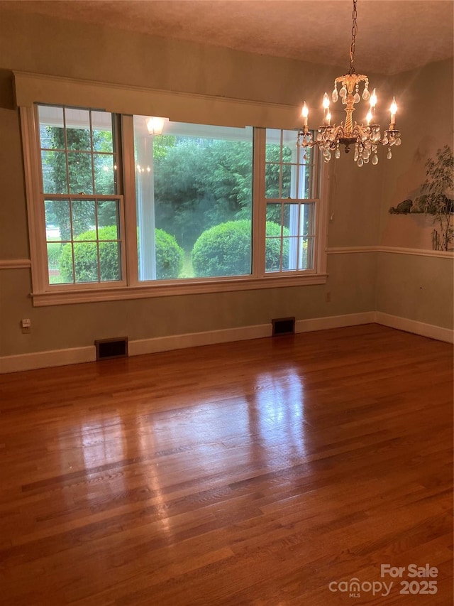 1614 Statesville Blvd, Salisbury, NC 28144 - empty room with a chandelier, plenty of natural light, and wood finished floors