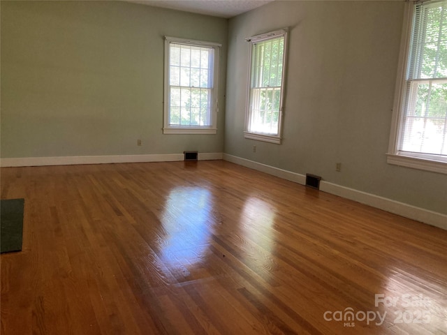 1614 Statesville Blvd, Salisbury, NC 28144 - spare room featuring wood finished floors and plenty of natural light