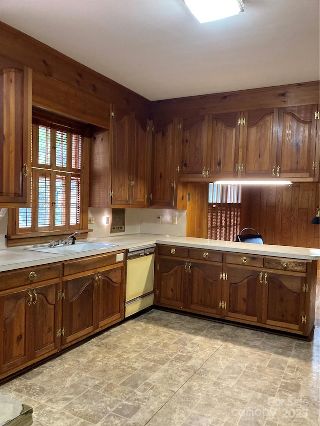 1614 Statesville Blvd, Salisbury, NC 28144 - kitchen with dishwasher, light countertops, stone finish floors, and brown cabinets