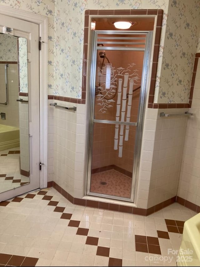 1614 Statesville Blvd, Salisbury, NC 28144 - bathroom with a tub, tile walls, a shower stall, wainscoting, and wallpapered walls
