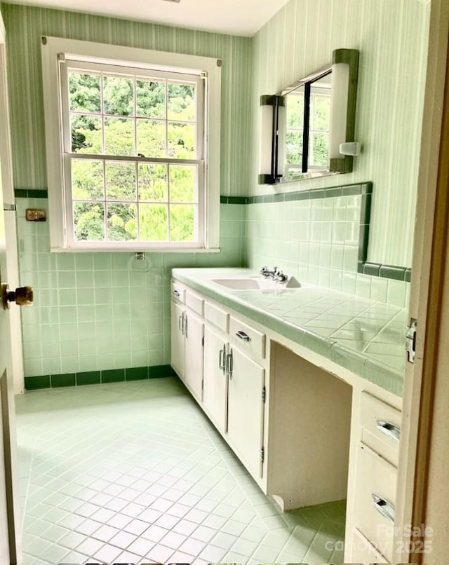 1614 Statesville Blvd, Salisbury, NC 28144 - bathroom with tile patterned flooring, vanity, plenty of natural light, tile walls, and wallpapered walls