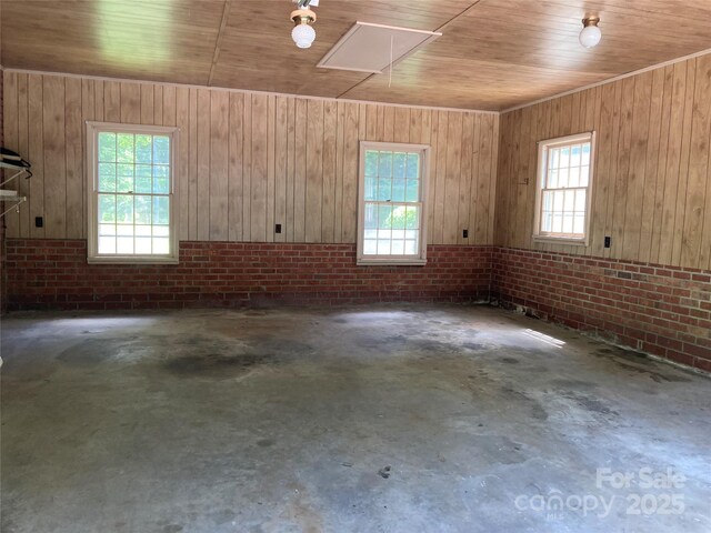 1614 Statesville Blvd, Salisbury, NC 28144 - spare room with plenty of natural light, wood ceiling, brick wall, unfinished concrete flooring, and attic access