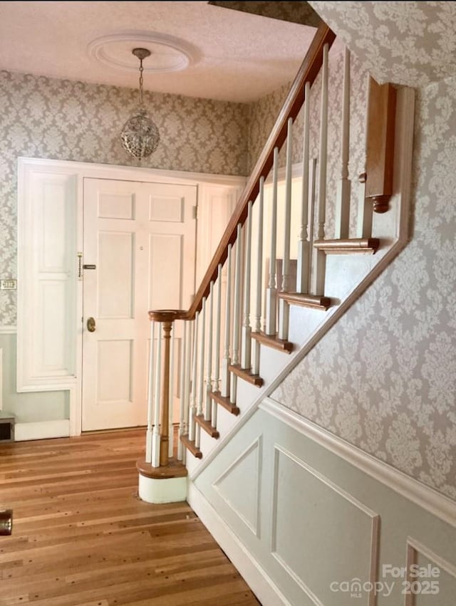 1614 Statesville Blvd, Salisbury, NC 28144 - staircase featuring wallpapered walls and wood finished floors