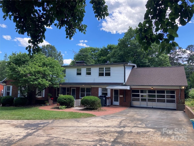 1614 Statesville Blvd, Salisbury, NC 28144 - traditional-style home with brick siding, a garage, driveway, and a front yard