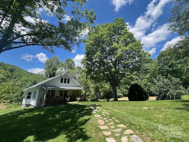 83 Kimberly Ln, Newland, NC 28657 - view of green lawn with covered porch