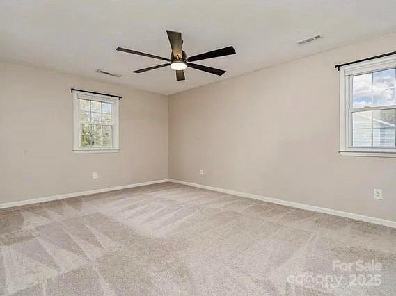 3572 Heather Ln, Gastonia, NC 28056 - carpeted empty room with ceiling fan, healthy amount of natural light, and baseboards