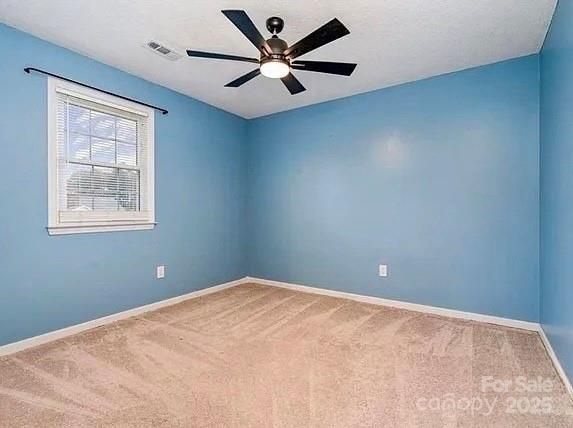 3572 Heather Ln, Gastonia, NC 28056 - carpeted spare room featuring baseboards and ceiling fan
