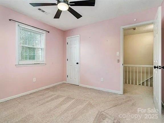 3572 Heather Ln, Gastonia, NC 28056 - unfurnished room featuring a ceiling fan, carpet floors, and baseboards