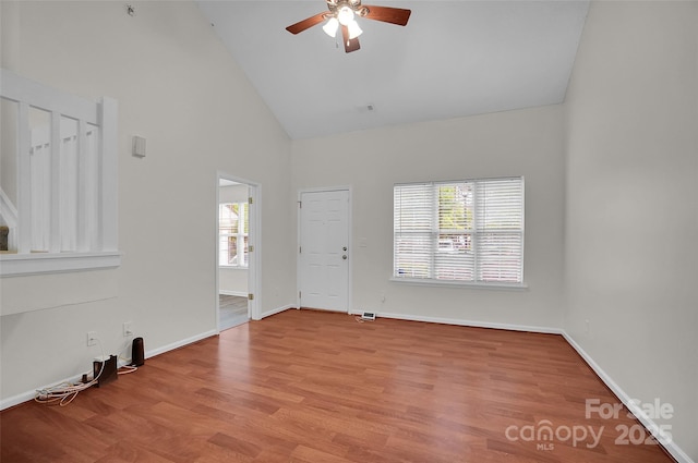 5237 Ficus Tree Ln, Charlotte, NC 28215 - unfurnished living room featuring high vaulted ceiling, ceiling fan, and wood finished floors