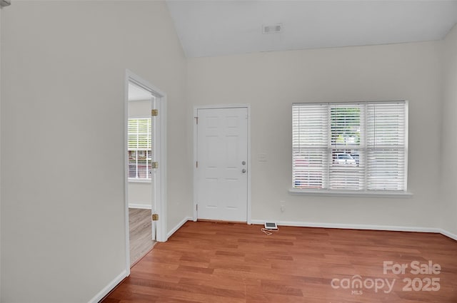 5237 Ficus Tree Ln, Charlotte, NC 28215 - entrance foyer featuring plenty of natural light, wood finished floors, and lofted ceiling
