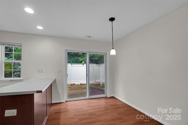 5237 Ficus Tree Ln, Charlotte, NC 28215 - unfurnished dining area featuring light wood-style floors and recessed lighting