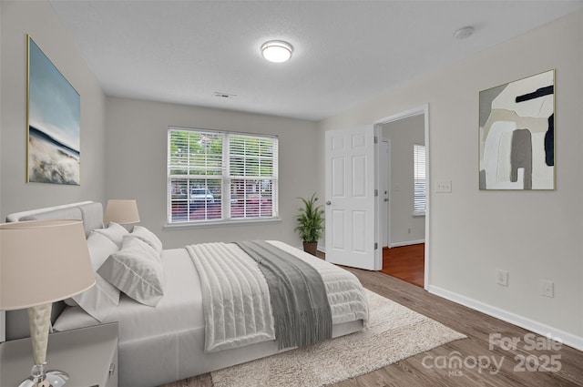 5237 Ficus Tree Ln, Charlotte, NC 28215 - bedroom featuring wood finished floors and baseboards