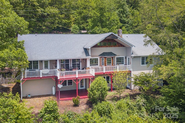 1706 Rock House Cove Rd, Clyde, NC 28721 - back of house with a deck, a chimney, and a shingled roof