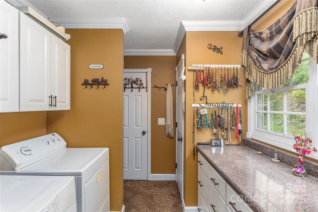 1706 Rock House Cove Rd, Clyde, NC 28721 - washroom featuring cabinet space, washing machine and clothes dryer, a textured ceiling, ornamental molding, and baseboards