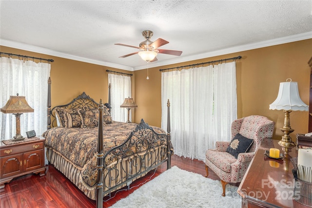 1706 Rock House Cove Rd, Clyde, NC 28721 - bedroom with dark wood-style flooring, multiple windows, crown molding, a textured ceiling, and a ceiling fan