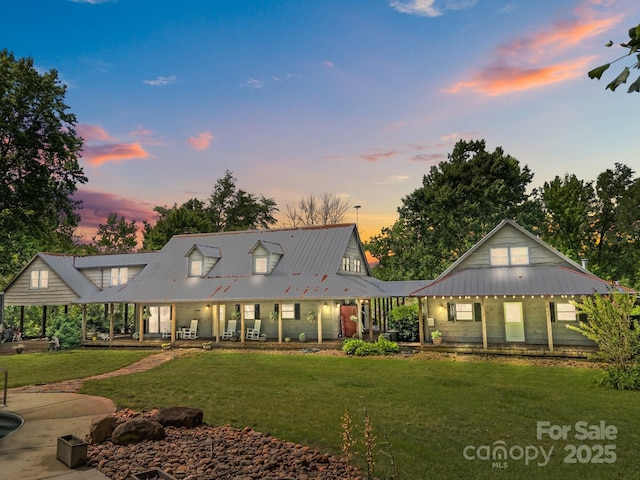 1433 Kern Carlton Rd, Salisbury, NC 28146 - view of front of home featuring covered porch, a lawn, and a metal roof