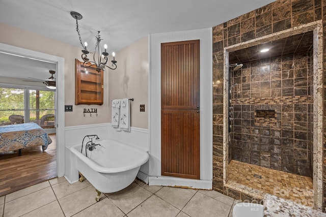1433 Kern Carlton Rd, Salisbury, NC 28146 - ensuite bathroom with a soaking tub, tiled shower, tile patterned flooring, ceiling fan, and wainscoting