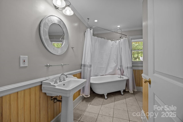 1433 Kern Carlton Rd, Salisbury, NC 28146 - full bathroom featuring a soaking tub, crown molding, wainscoting, tile patterned flooring, and a shower with shower curtain