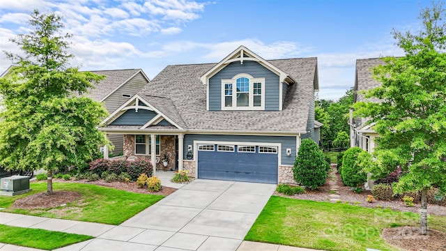 1284 Independence St, Fort Mill, SC 29708 - craftsman inspired home featuring concrete driveway, stone siding, a front lawn, a garage, and a shingled roof