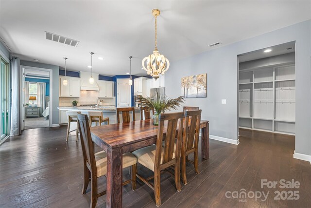 1284 Independence St, Fort Mill, SC 29708 - dining room with a chandelier, baseboards, recessed lighting, and dark wood-type flooring