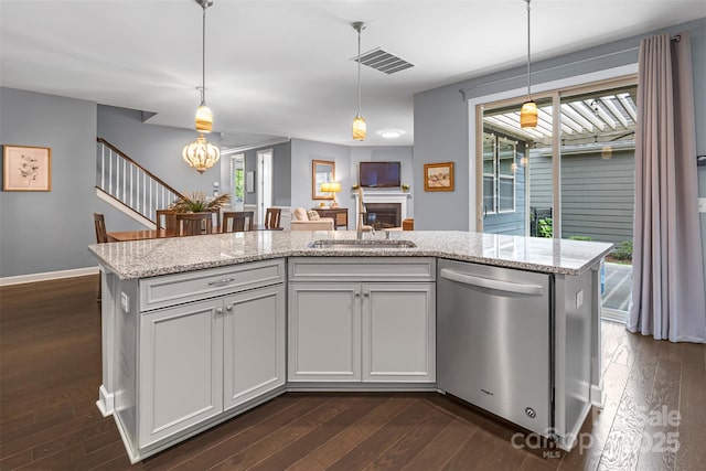 1284 Independence St, Fort Mill, SC 29708 - kitchen featuring stainless steel dishwasher, a sink, dark wood finished floors, pendant lighting, and a chandelier