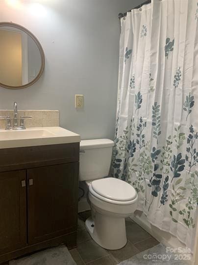 120 Booker St, Wingate, NC 28112 - full bath with vanity, toilet, tile patterned flooring, and a shower with curtain