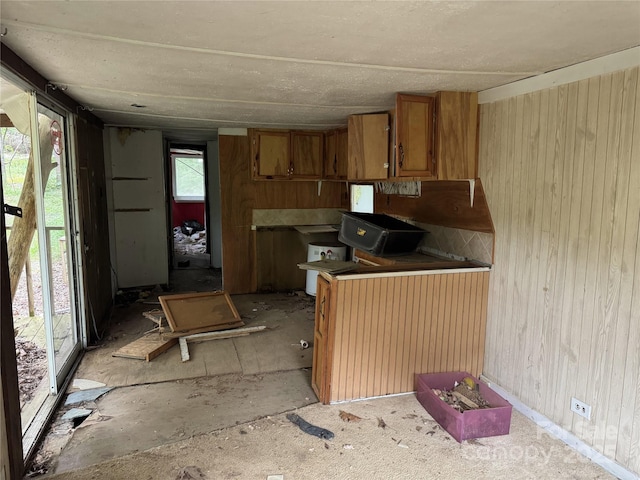 509 Waring Ct Lot 4, Fort Mill, SC 29707 - kitchen featuring brown cabinetry and wood walls