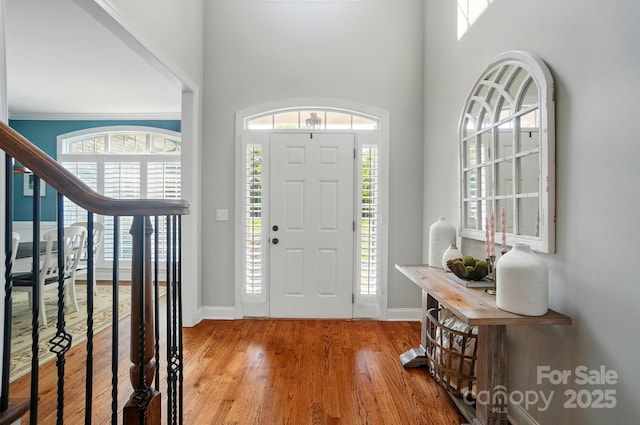 7006 Nesbit Rd, Waxhaw, NC 28173 - foyer featuring wood finished floors, baseboards, and a towering ceiling