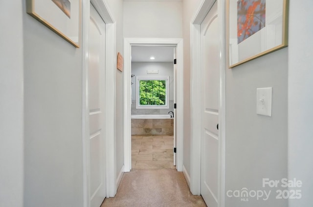 7006 Nesbit Rd, Waxhaw, NC 28173 - hallway with light colored carpet and baseboards