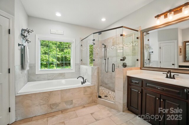 7006 Nesbit Rd, Waxhaw, NC 28173 - bathroom featuring a garden tub, vanity, a shower stall, tile patterned floors, and recessed lighting