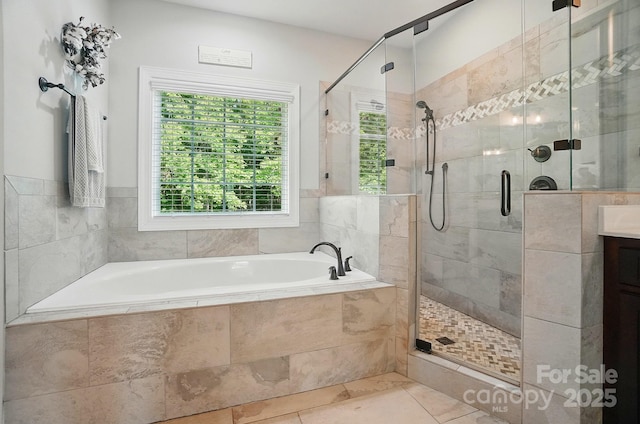 7006 Nesbit Rd, Waxhaw, NC 28173 - bathroom with a garden tub, a stall shower, vanity, and tile patterned floors