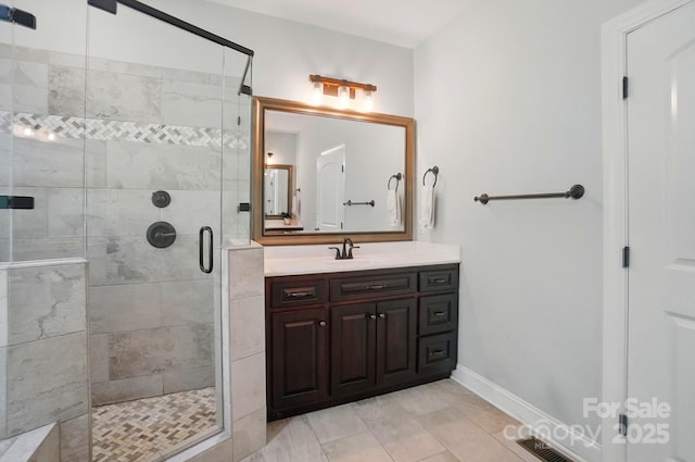 7006 Nesbit Rd, Waxhaw, NC 28173 - bathroom with vanity, a stall shower, and baseboards