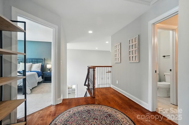 7006 Nesbit Rd, Waxhaw, NC 28173 - hall featuring an upstairs landing, wood finished floors, baseboards, and recessed lighting