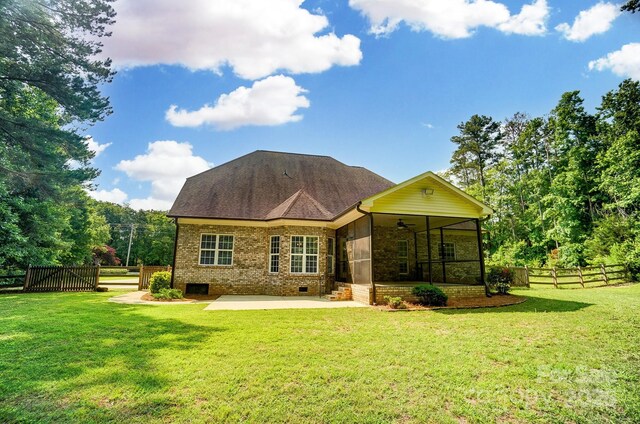 7006 Nesbit Rd, Waxhaw, NC 28173 - back of house with ceiling fan, a sunroom, a patio, brick siding, and crawl space