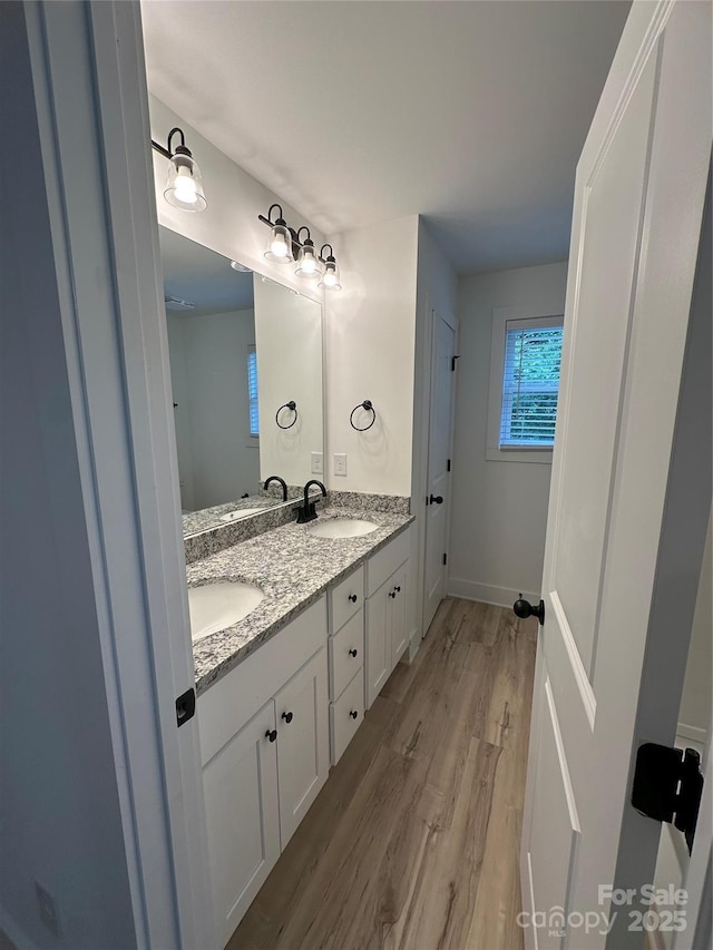 807 S Bostian St, China Grove, NC 28023 - full bathroom featuring double vanity and wood finished floors