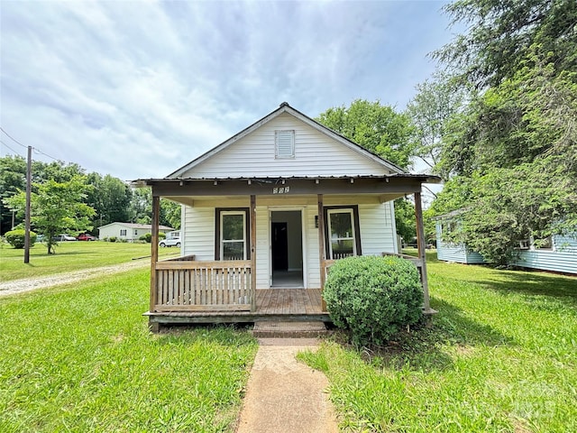 502 E Main St, Cleveland, NC 27013 - view of front of house with covered porch and a front yard