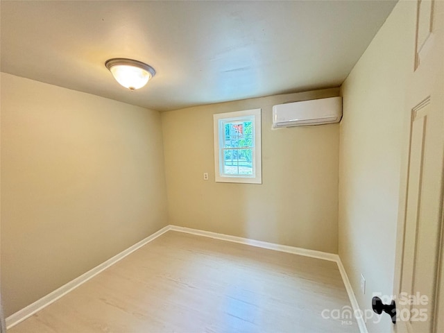 502 E Main St, Cleveland, NC 27013 - unfurnished room featuring a wall mounted AC, light wood-type flooring, and baseboards