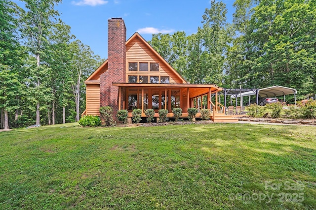 6350 Mount Pleasant Rd S, Concord, NC 28025 - rear view of house with a chimney, a detached carport, and a lawn