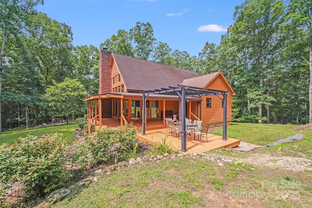 6350 Mount Pleasant Rd S, Concord, NC 28025 - back of property featuring a pergola, a yard, a deck, a chimney, and a shingled roof