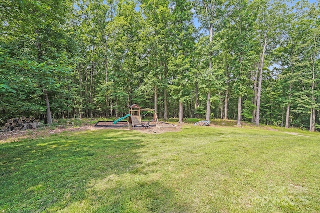 6350 Mount Pleasant Rd S, Concord, NC 28025 - view of green lawn featuring a playground and a view of trees