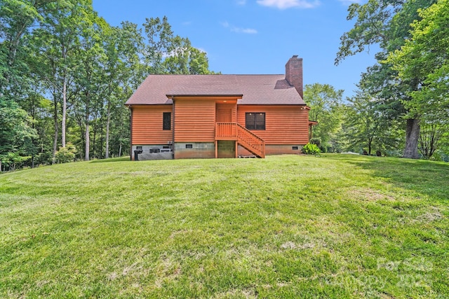 6350 Mount Pleasant Rd S, Concord, NC 28025 - back of property featuring a chimney, a yard, and roof with shingles