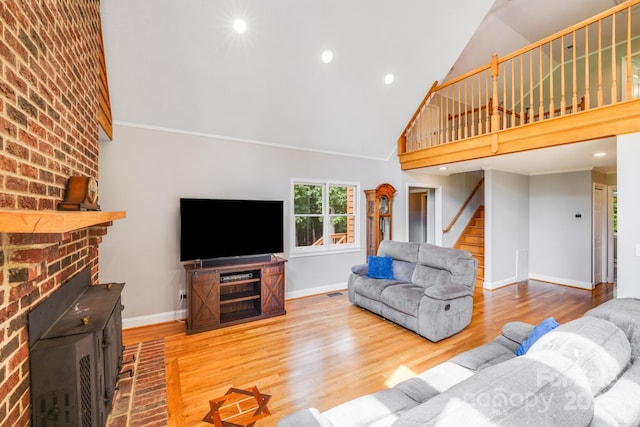 6350 Mount Pleasant Rd S, Concord, NC 28025 - living area featuring high vaulted ceiling, stairs, wood finished floors, baseboards, and recessed lighting