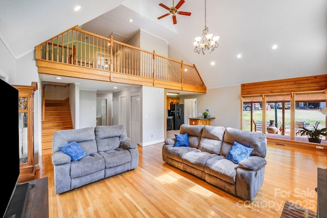 6350 Mount Pleasant Rd S, Concord, NC 28025 - living room featuring high vaulted ceiling, a ceiling fan, wood finished floors, a chandelier, and stairway