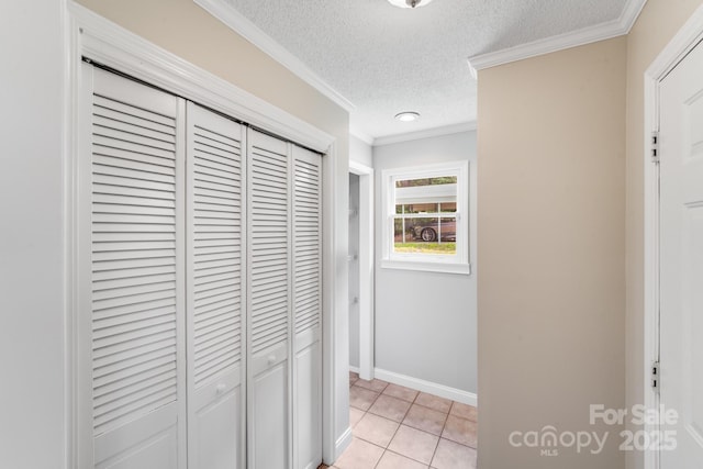 6350 Mount Pleasant Rd S, Concord, NC 28025 - hallway with a textured ceiling, ornamental molding, baseboards, and light tile patterned flooring