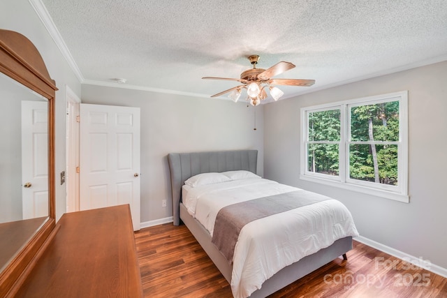 6350 Mount Pleasant Rd S, Concord, NC 28025 - bedroom with a textured ceiling, wood finished floors, baseboards, a ceiling fan, and ornamental molding