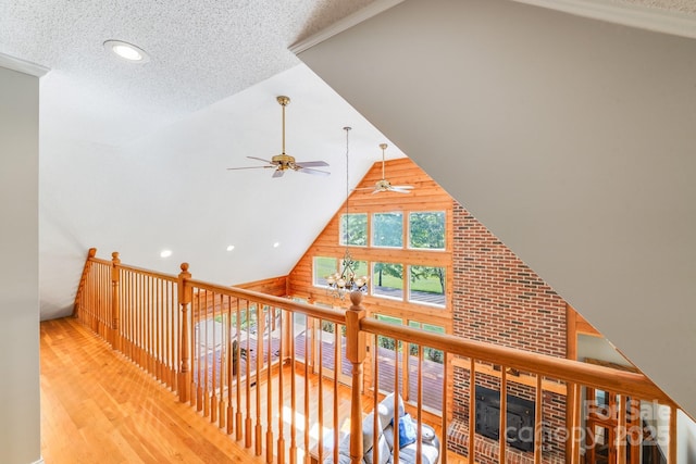 6350 Mount Pleasant Rd S, Concord, NC 28025 - hall featuring wood finished floors, a textured ceiling, recessed lighting, and high vaulted ceiling