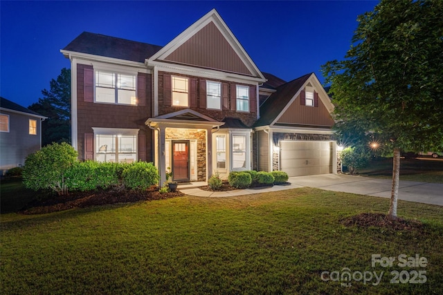 4500 Carrington Dr, Lancaster, SC 29720 - view of front of home with concrete driveway, a lawn, stone siding, and an attached garage