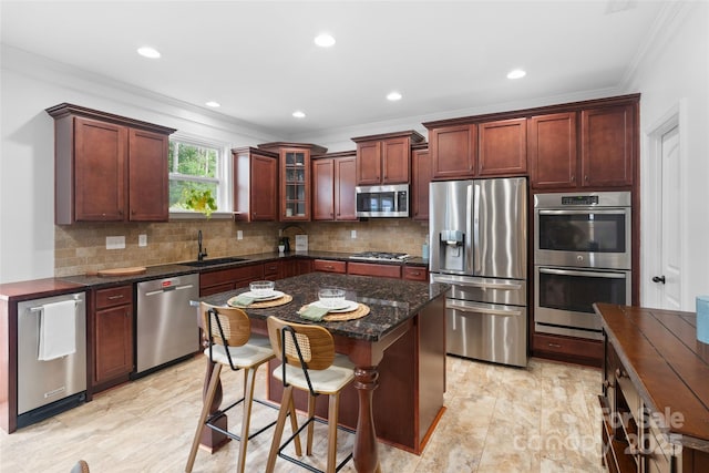 4500 Carrington Dr, Lancaster, SC 29720 - kitchen featuring appliances with stainless steel finishes, crown molding, a sink, backsplash, and glass insert cabinets